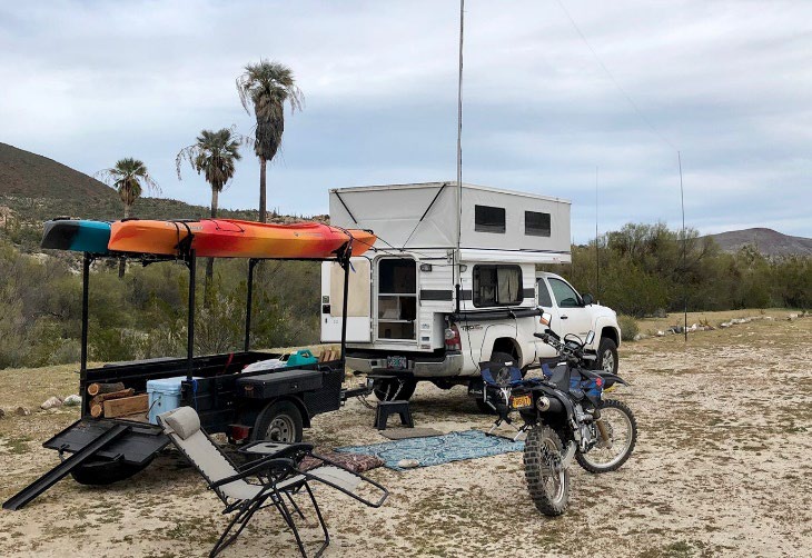 Four Wheel Truck Campers & Turtleback Trailer A Dynamic Duo